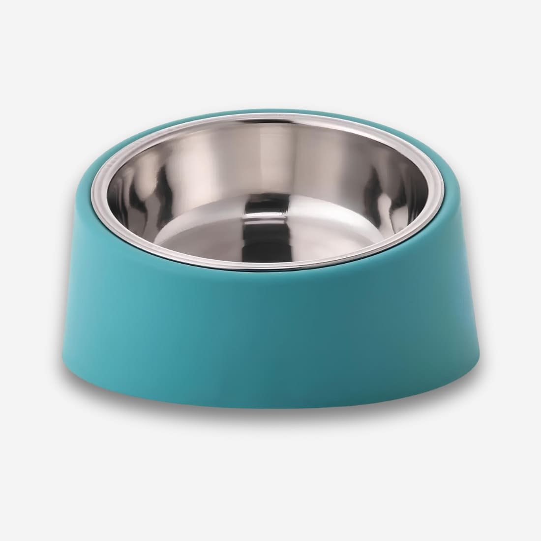 Bol orthopédique pour chat anti-renversement. La coupelle est en inox, l'extérieur est vert en plastique. Sur fond uni clair.