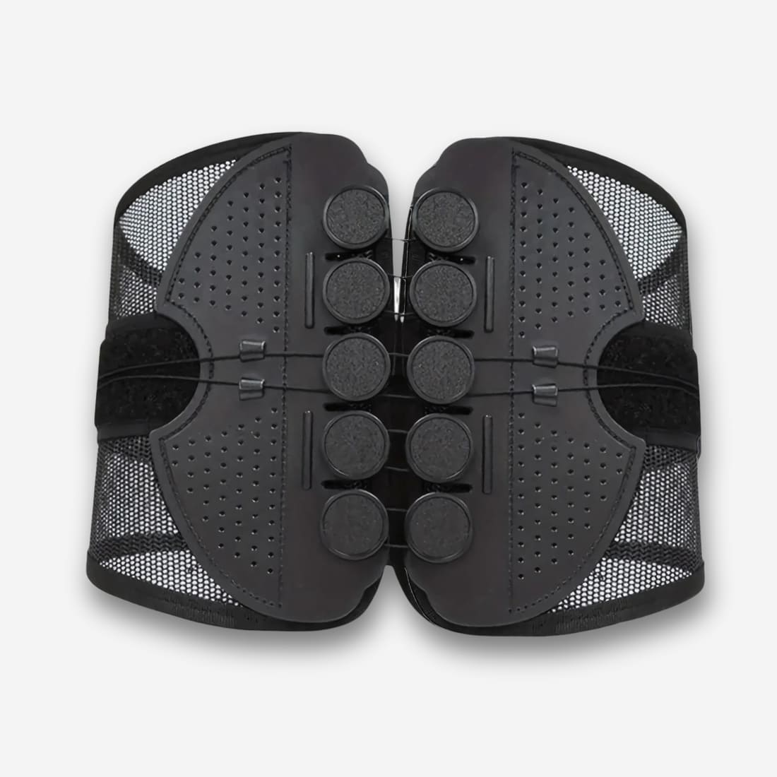 Ceinture orthopédique réglable pour soutien lombaire noire, maille ajourée. Sur fond uni clair.